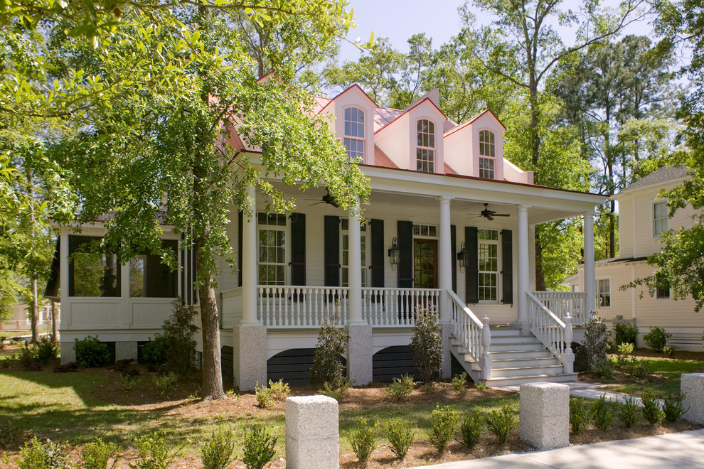 Elegant wood exterior home photo in Charleston