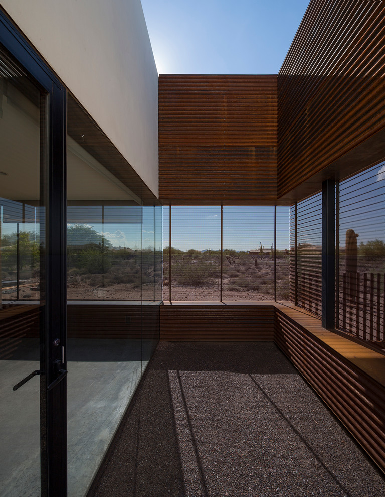 Large modern gray two-story metal flat roof idea in Phoenix