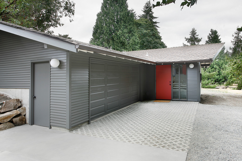Inspiration for a gey and medium sized midcentury bungalow house exterior in Seattle with a pitched roof.