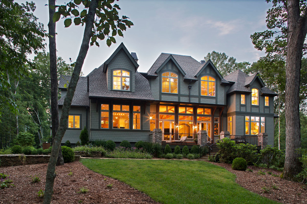 Inspiration for a mid-sized craftsman green two-story mixed siding exterior home remodel in Other with a hip roof
