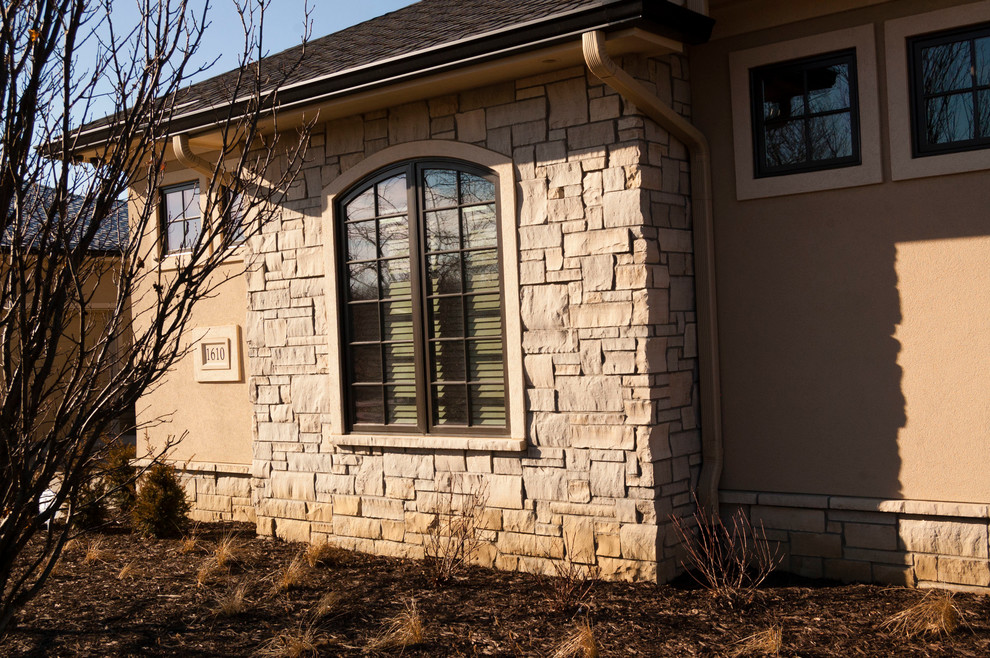 Tuscan exterior home photo in Omaha