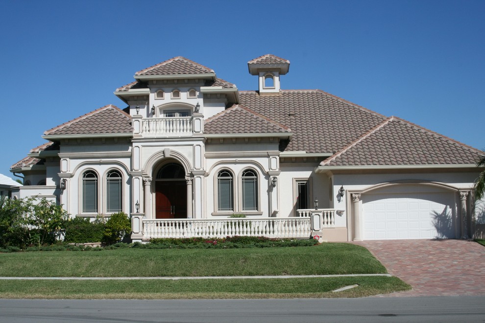 Example of a tuscan exterior home design in Miami