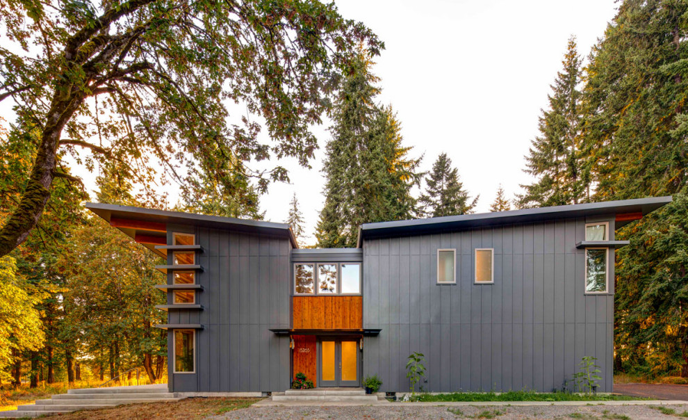 Diseño de fachada de casa gris actual con tejado de un solo tendido