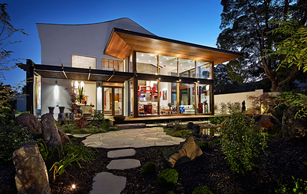 Design ideas for a world-inspired house exterior in Melbourne.