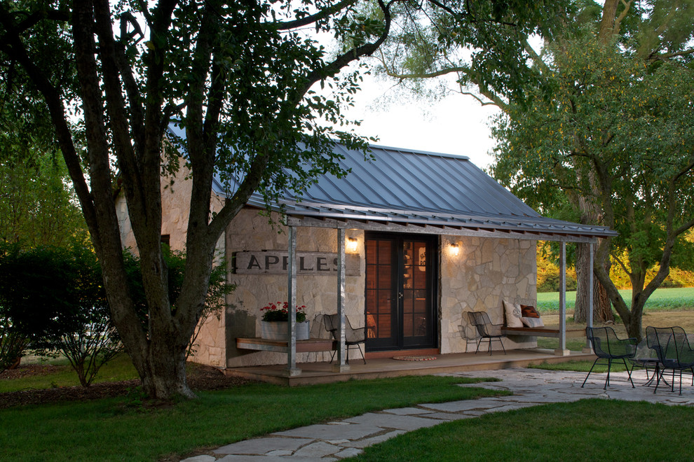 Example of a tuscan stone exterior home design in Chicago