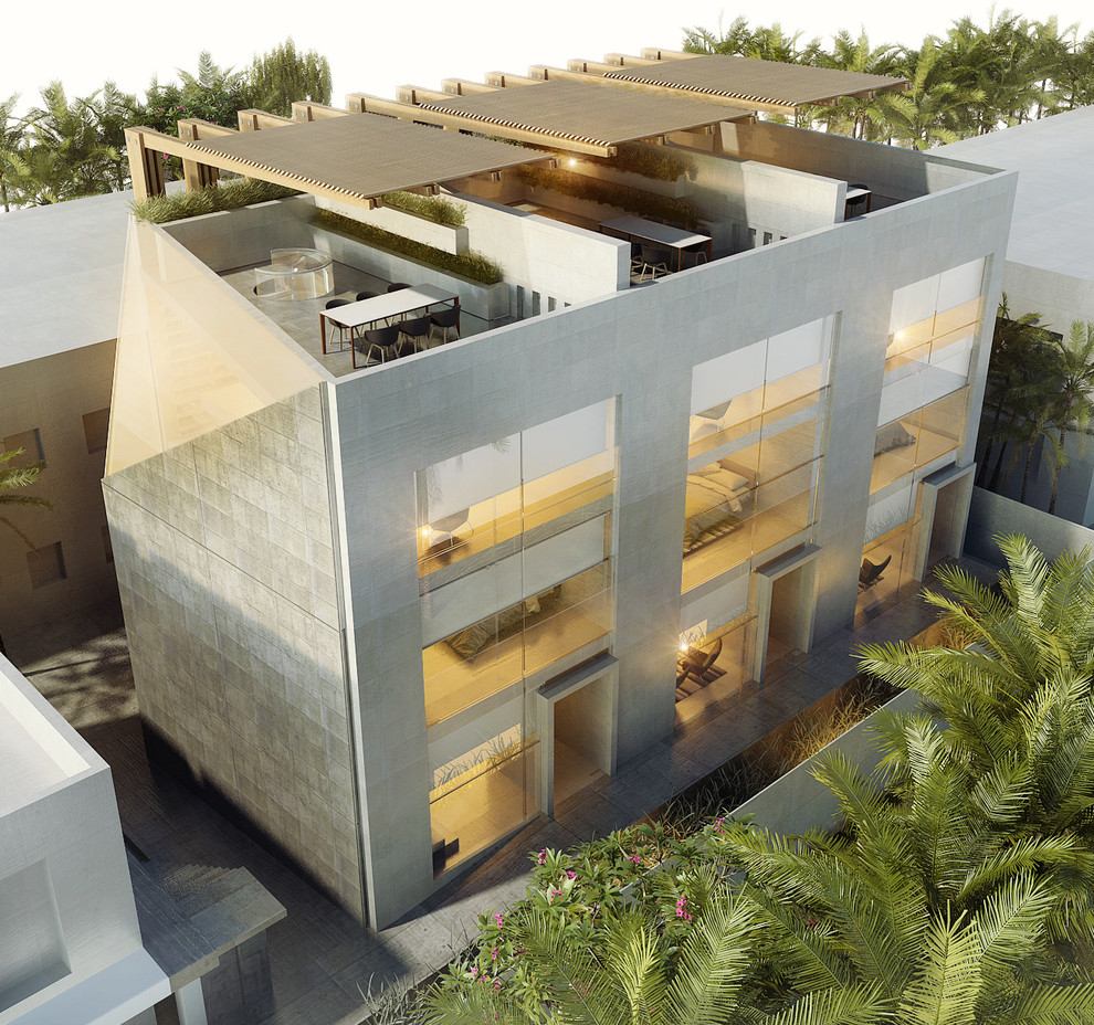 Inspiration pour une façade de maison minimaliste en béton à deux étages et plus.