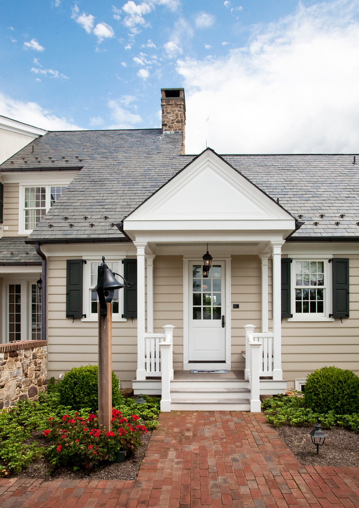 Cottage beige one-story exterior home photo in Philadelphia