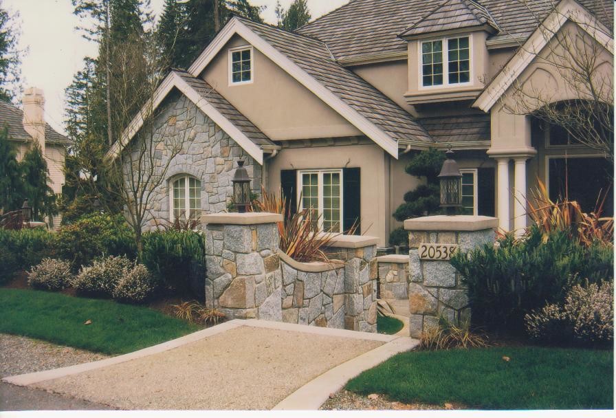 Mid-sized trendy beige two-story stucco exterior home photo in Seattle