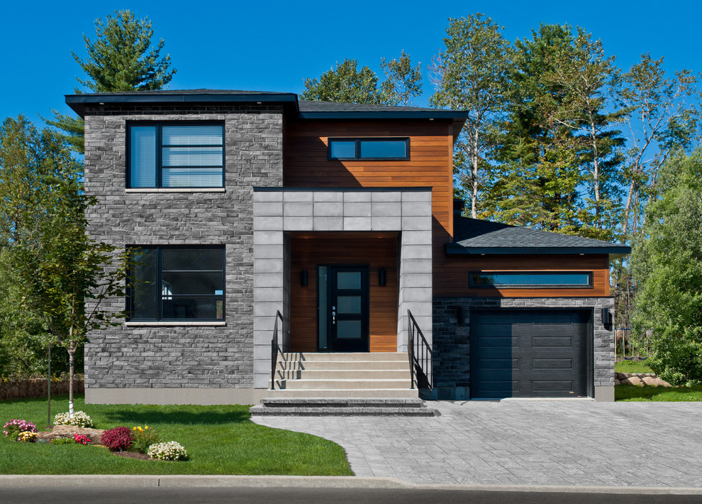 This is an example of a contemporary concrete house exterior in Montreal.