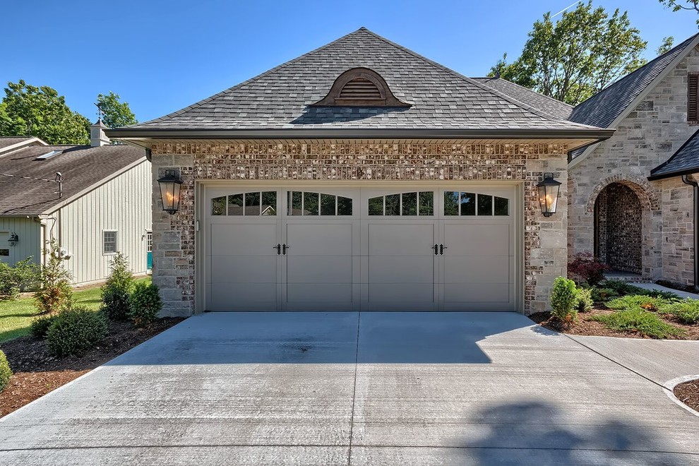 This is an example of a large traditional garage in Other.