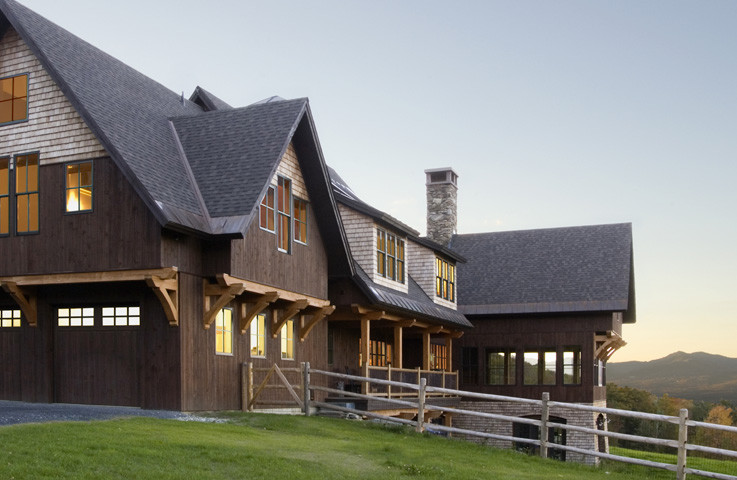 Inspiration for a huge timeless brown three-story wood exterior home remodel in Burlington with a shingle roof