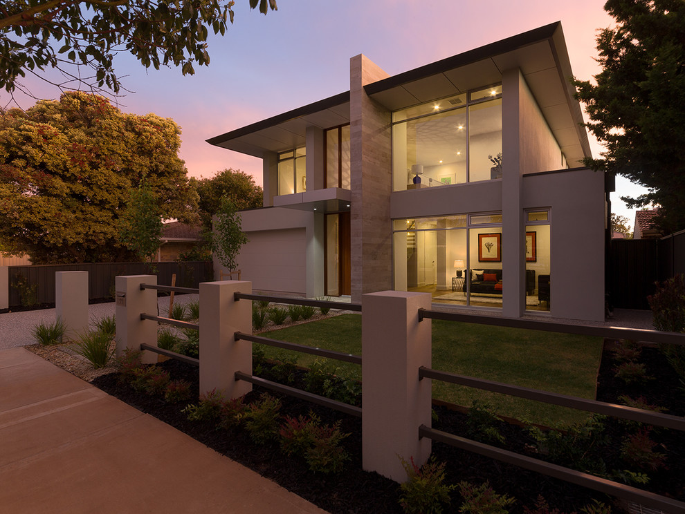 На фото: большой, двухэтажный, кирпичный, серый дом в современном стиле с