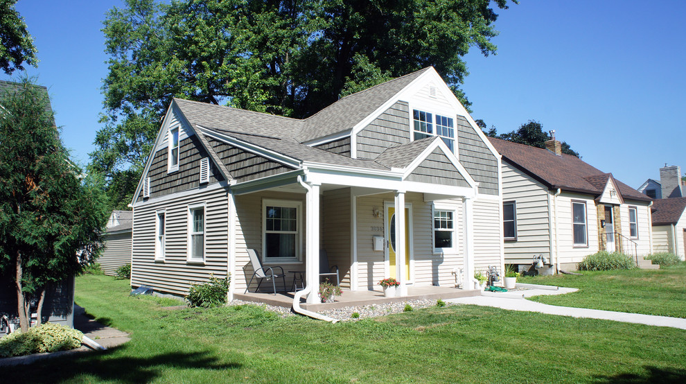 Photo of a small and gey classic two floor detached house in Minneapolis with vinyl cladding, a pitched roof and a shingle roof.
