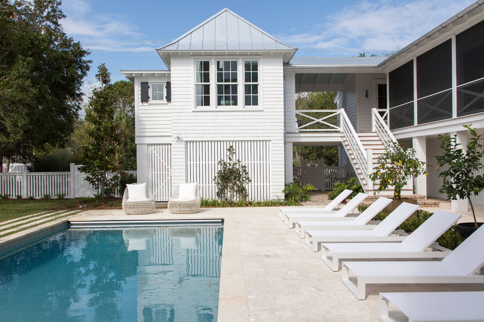 Beach style white two-story wood gable roof photo in Charleston