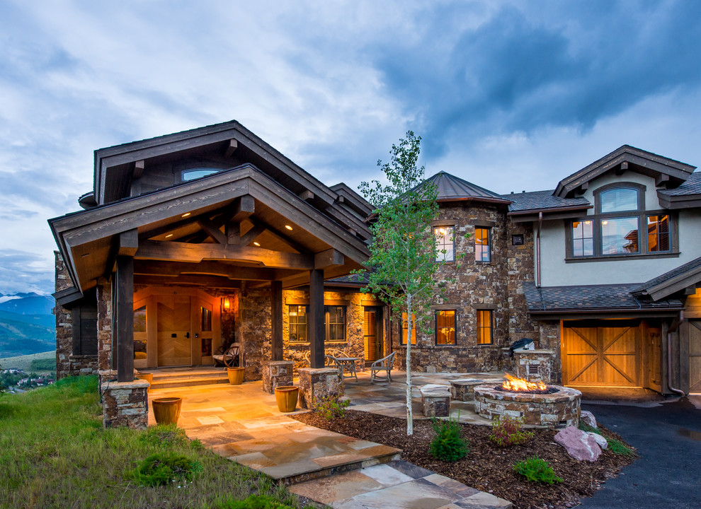 Large mountain style white two-story mixed siding exterior home photo in Denver with a mixed material roof