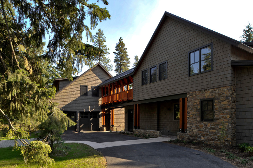 Brown traditional house exterior in Seattle with stone cladding and a pitched roof.