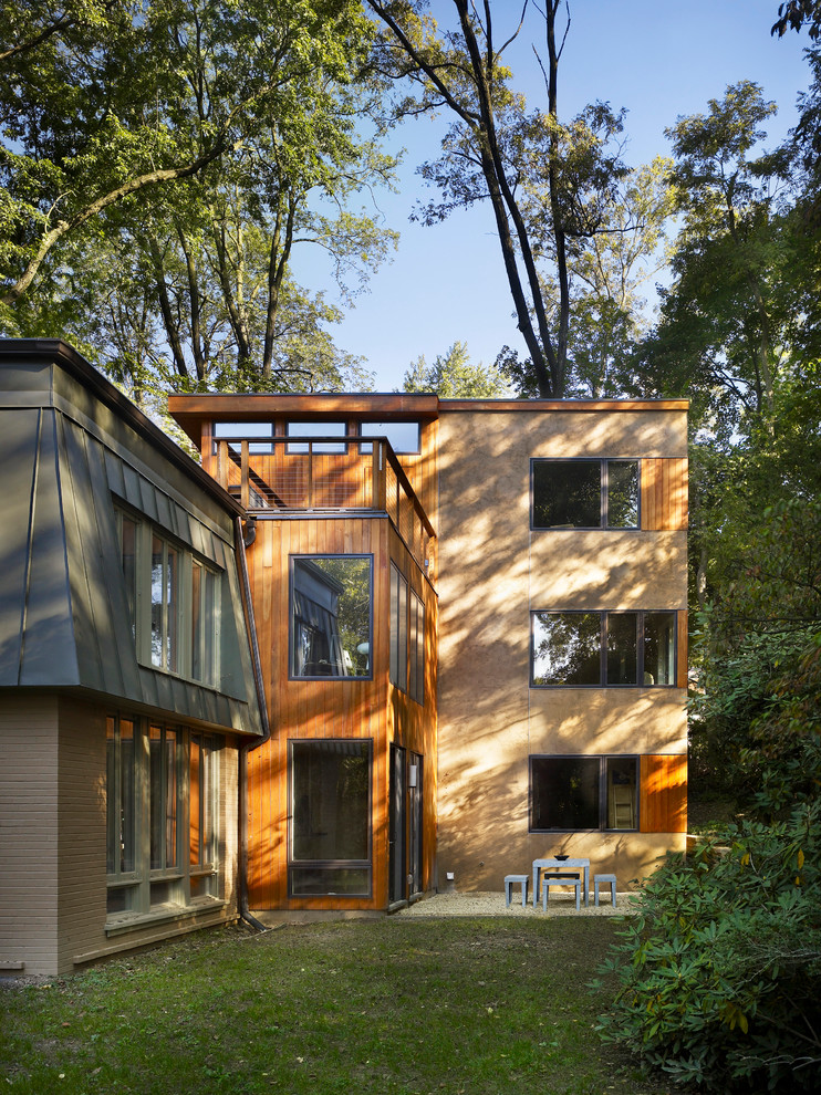 Inspiration för moderna hus, med tre eller fler plan, blandad fasad och platt tak