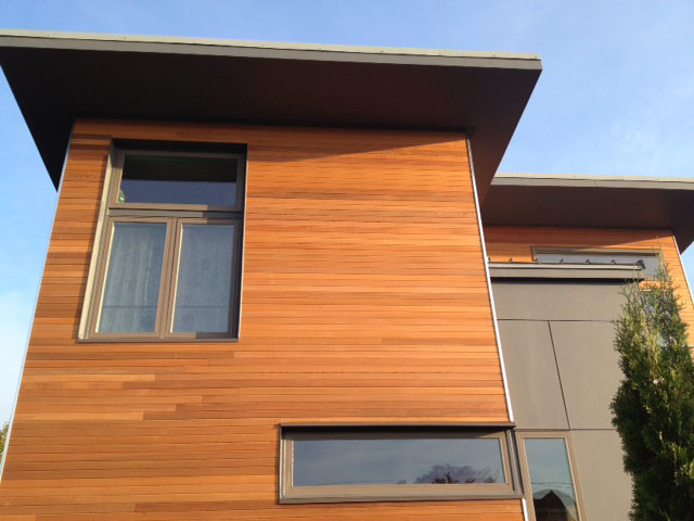 Inspiration for a small contemporary wood exterior home remodel in Seattle