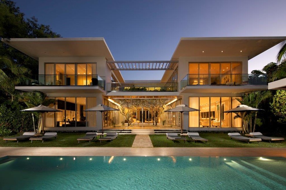 Inspiration for a huge contemporary white two-story vinyl flat roof remodel in Miami