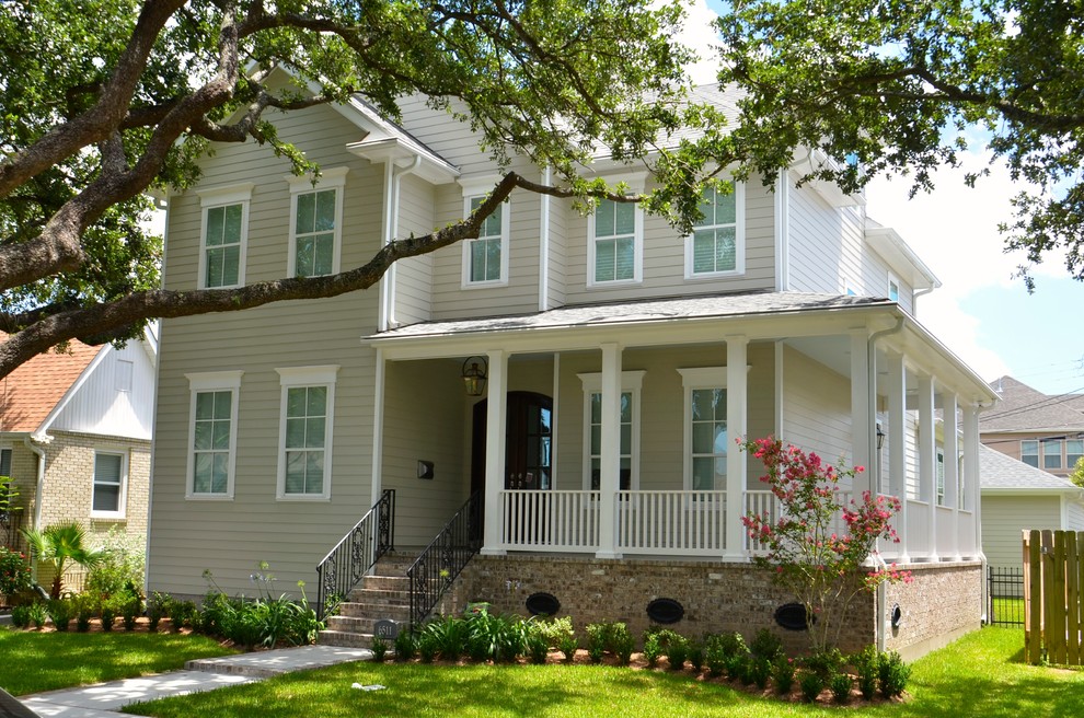 Inspiration for a mid-sized timeless beige three-story wood exterior home remodel in New Orleans