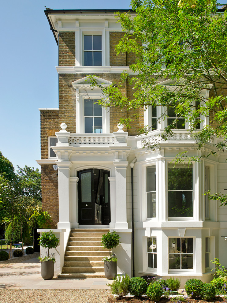 Photo of a traditional brick house exterior in London with three floors.