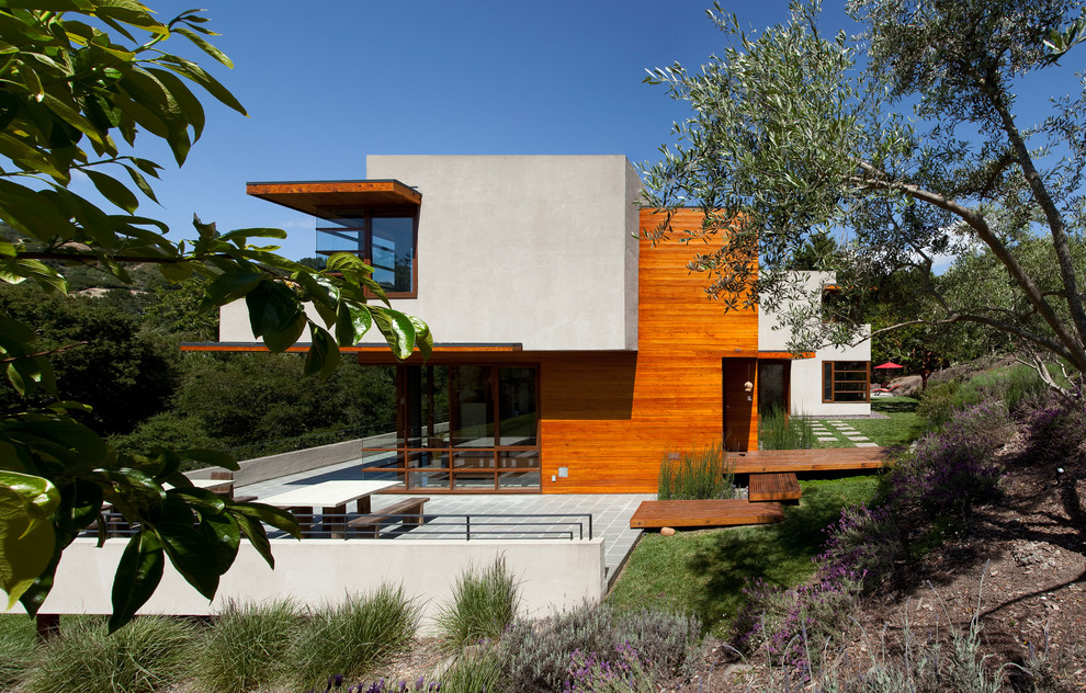 This is an example of a large modern house exterior in San Francisco with three floors, mixed cladding and a flat roof.