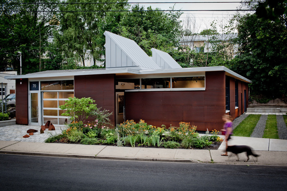 Inspiration for an industrial one-story metal exterior home remodel in New York