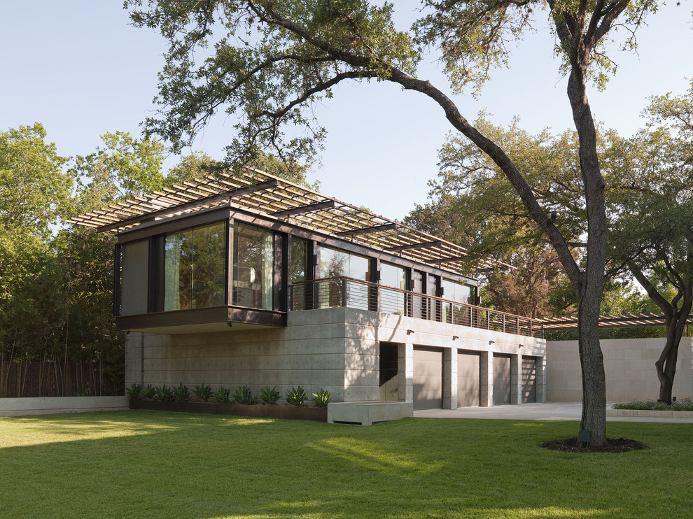 Inspiration for a mid-sized modern brown two-story concrete exterior home remodel in Austin