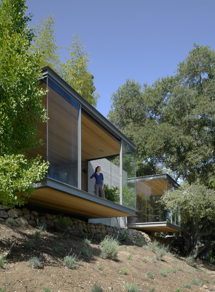 Small modern one-story glass flat roof idea in San Francisco