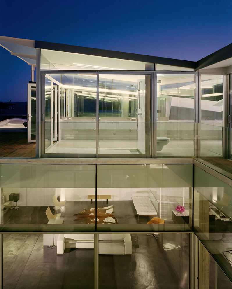 Design ideas for a modern glass house exterior in San Francisco with a lean-to roof.