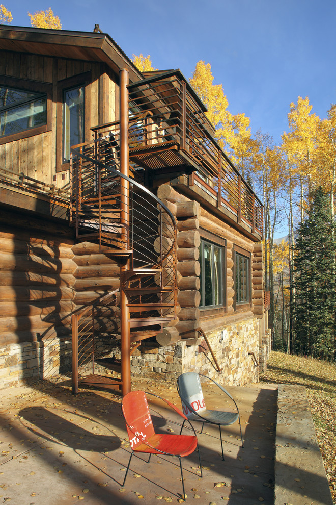 Rustic house exterior in Denver with wood cladding.