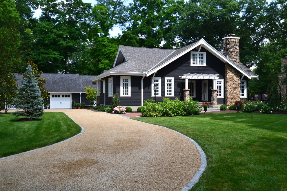 Photo of a large and black classic bungalow detached house in Cincinnati with wood cladding, a pitched roof and a shingle roof.