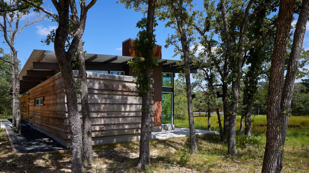 Inspiration for a medium sized bungalow detached house in Houston with a lean-to roof and a metal roof.