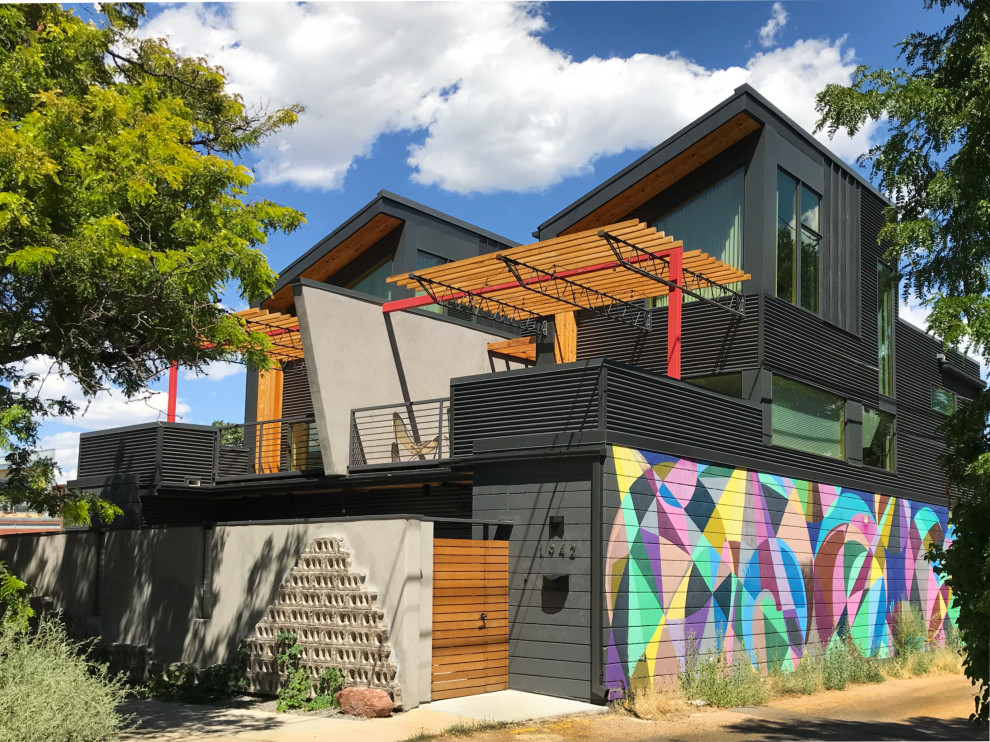 Inspiration for a medium sized and gey industrial semi-detached house in Denver with three floors, mixed cladding, a lean-to roof and a metal roof.