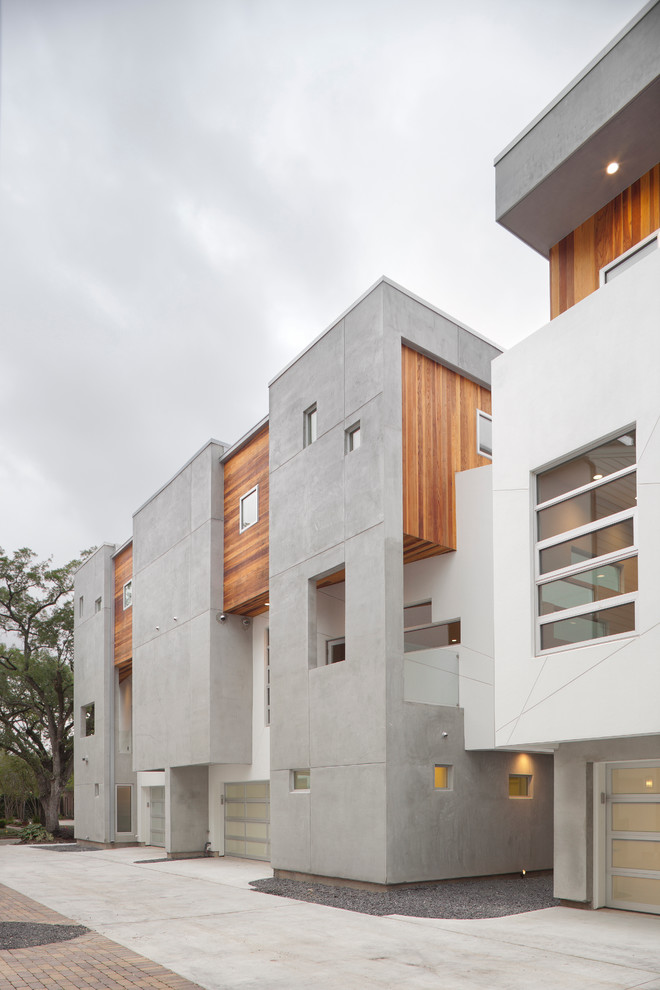 Design ideas for a contemporary house exterior in Houston with three floors and mixed cladding.