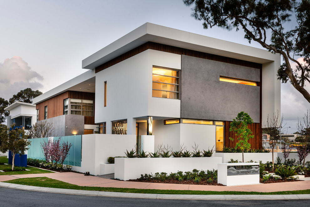 White contemporary two floor house exterior in Perth with mixed cladding and a flat roof.