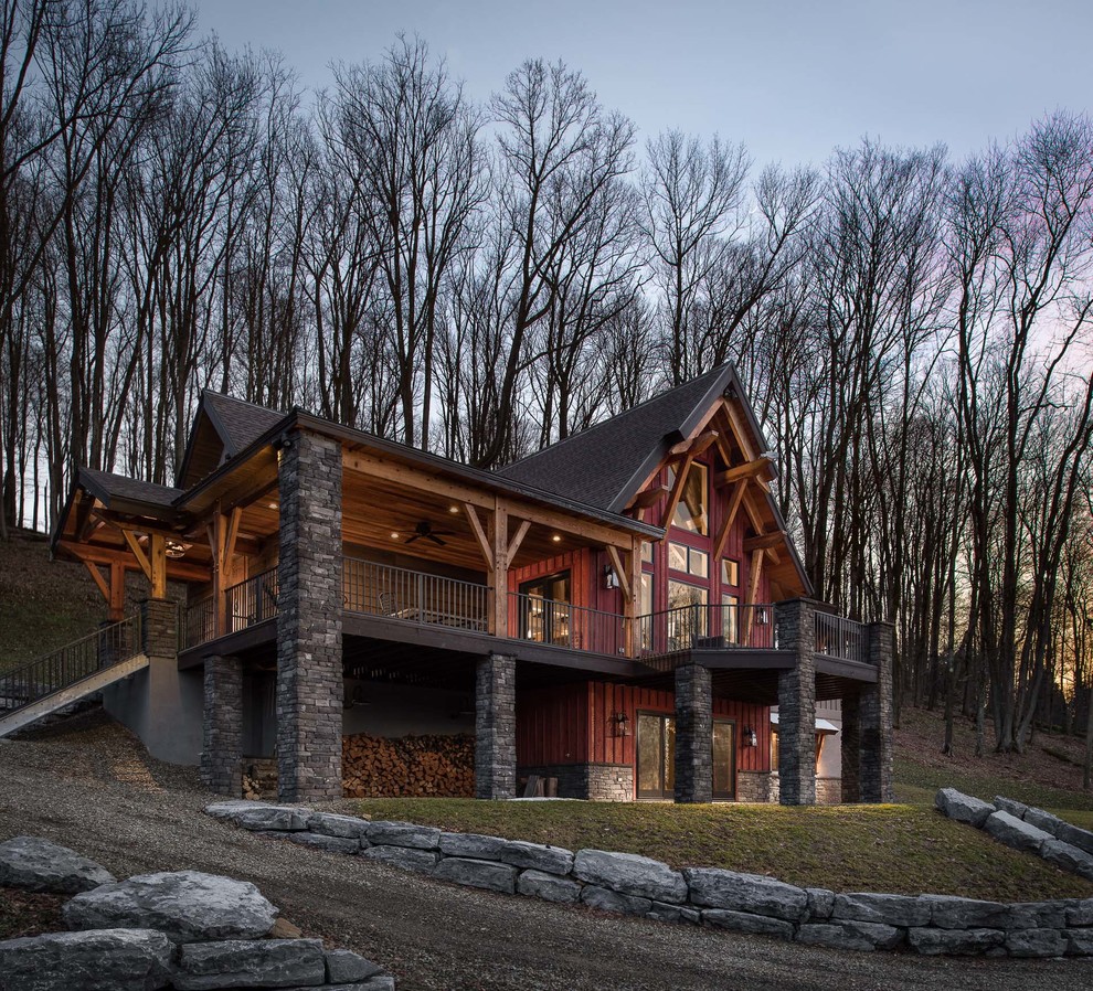 Large rustic red two-story wood gable roof idea in New York