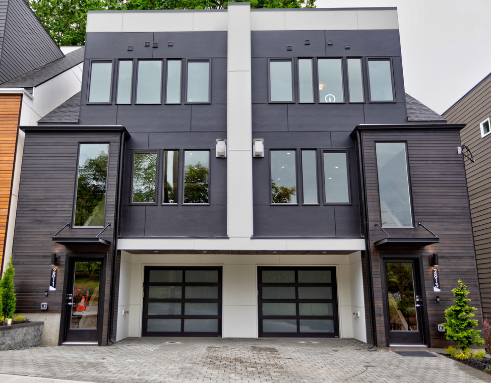 Mittelgroßes, Dreistöckiges Modernes Reihenhaus mit Mix-Fassade, schwarzer Fassadenfarbe und Flachdach in Seattle