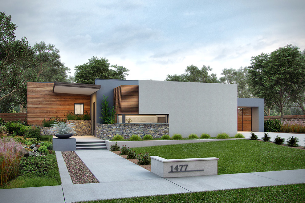 Inspiration pour une façade de maison grise minimaliste en stuc de taille moyenne et de plain-pied avec un toit plat.
