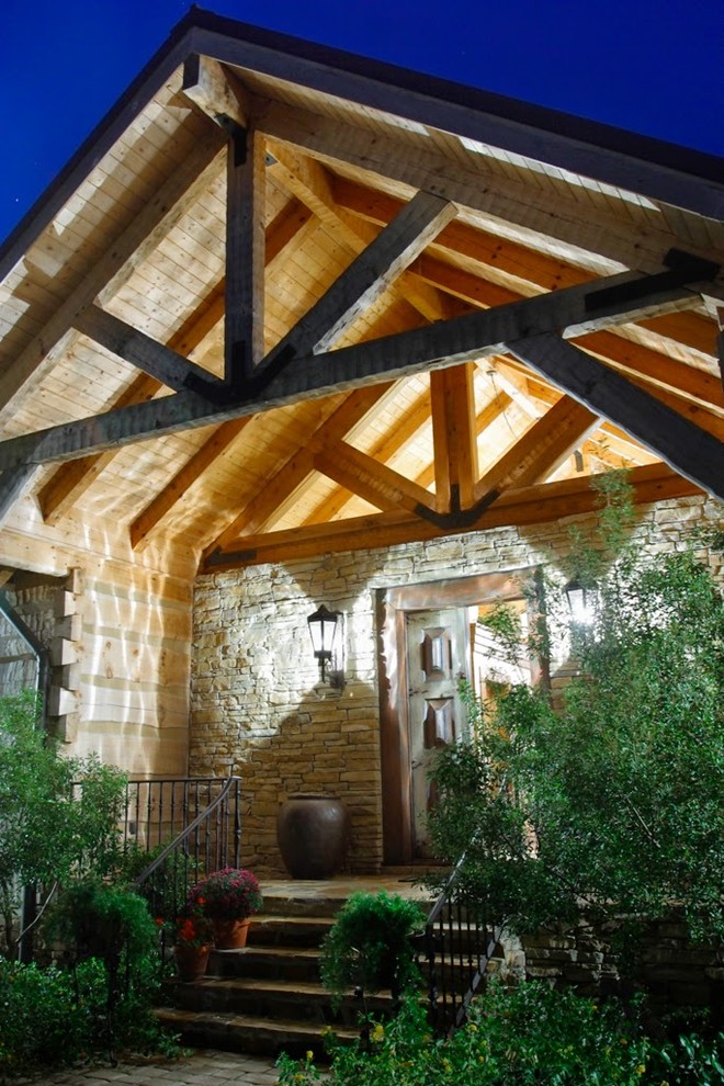 Large mountain style two-story wood gable roof photo in Other