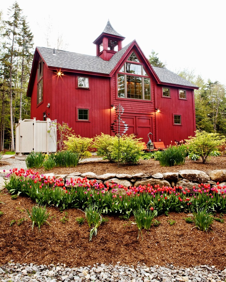 Large elegant red two-story wood gable roof photo in Manchester