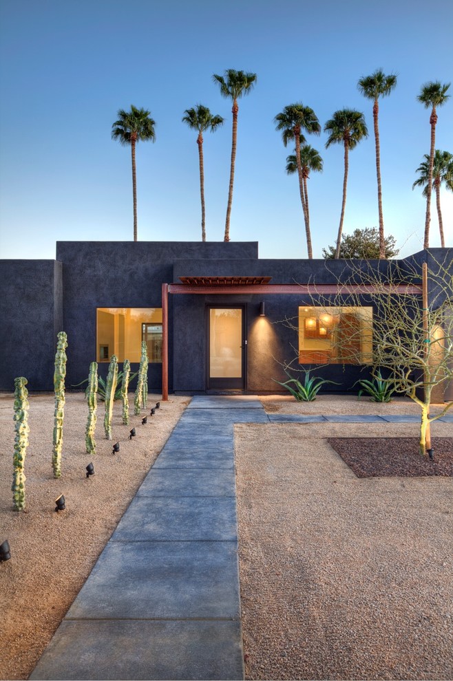Foto de fachada gris minimalista de una planta con tejado plano