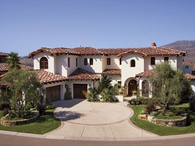 Design ideas for a large and white traditional two floor clay house exterior in San Diego.