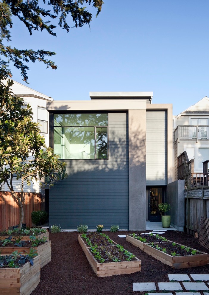 Inspiration för mellanstora eklektiska grå betonghus, med två våningar och platt tak