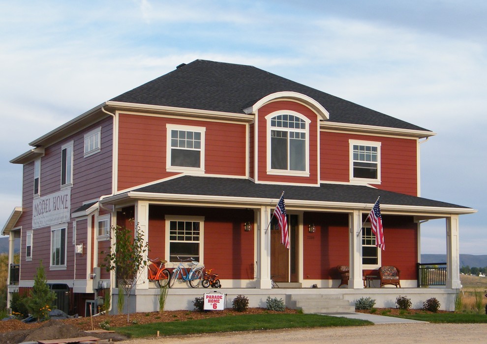 Idee per la facciata di una casa grande rossa american style a due piani con rivestimento con lastre in cemento