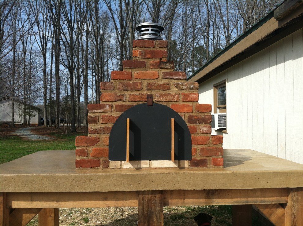 The Garrett Builders Wood Fired Brick Pizza Oven in North Carolina Farmhouse Exterior