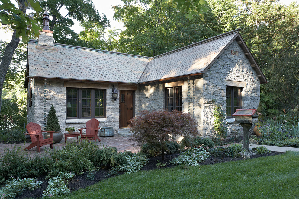 Mountain style stone exterior home photo in Minneapolis