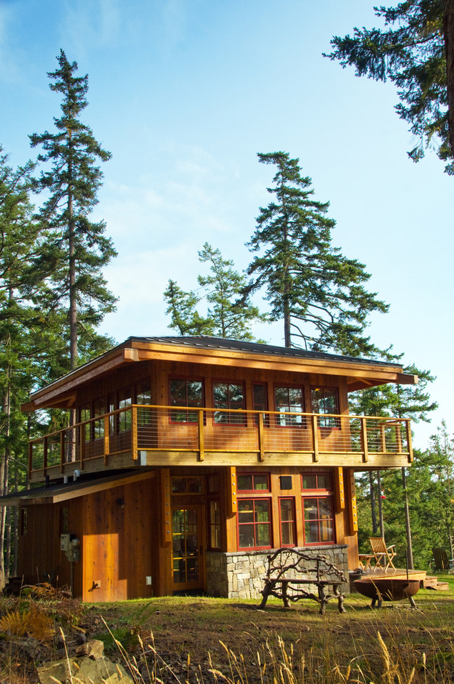 Example of a mountain style stone exterior home design in Seattle