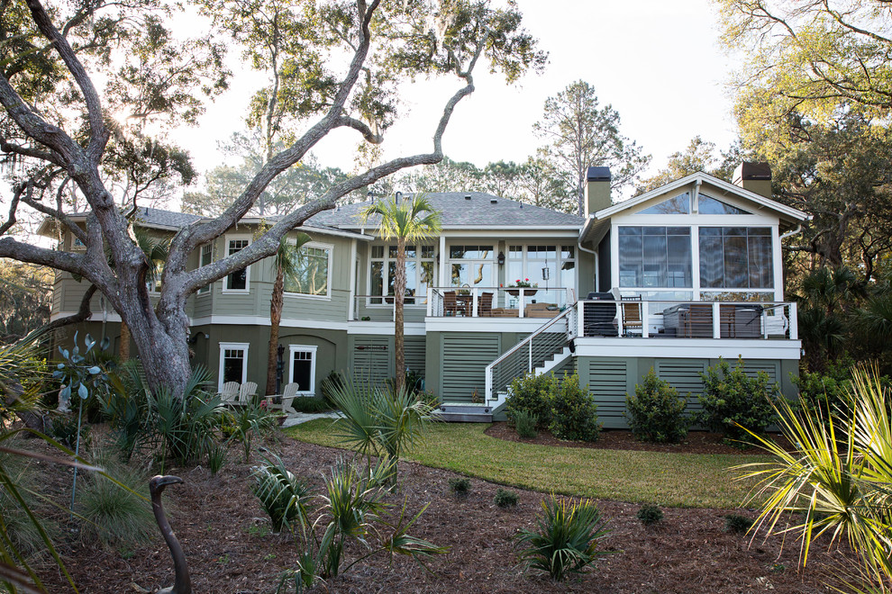 Inspiration for a large timeless gray two-story wood exterior home remodel in Charleston with a shingle roof