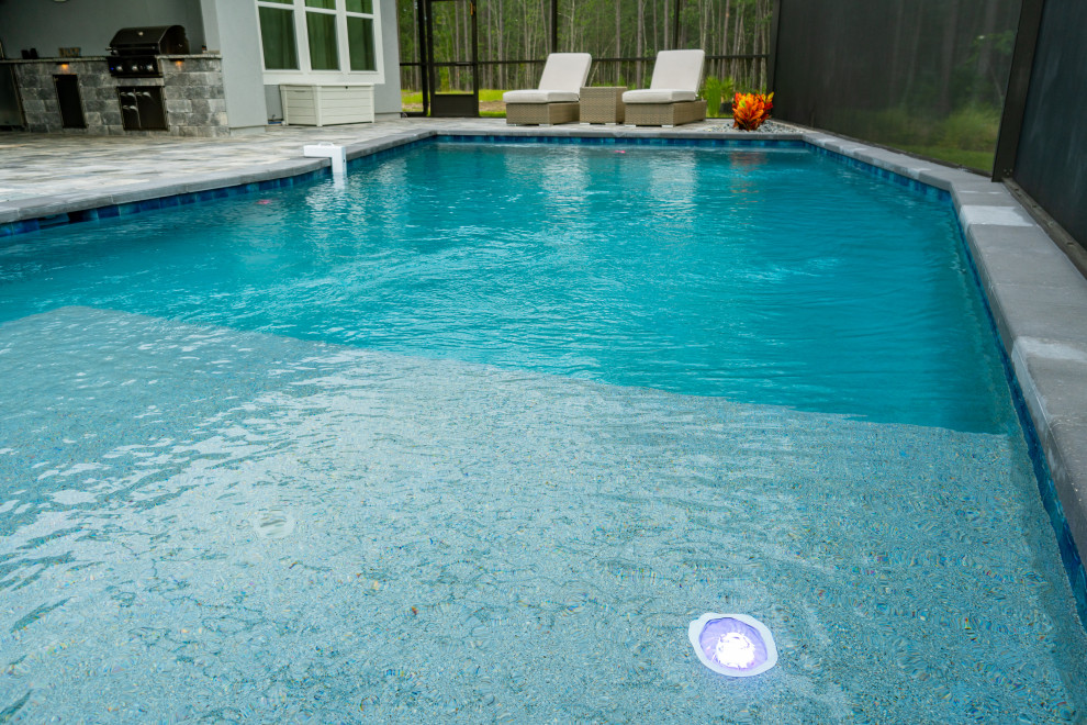 This is an example of a large contemporary swimming pool in Jacksonville.